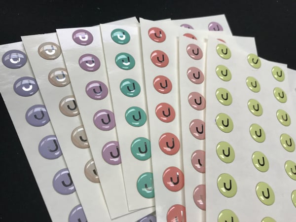 brand labels pop with color and get enhanced with doming process